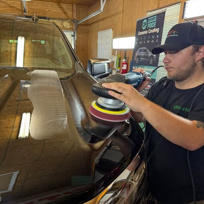 Level Up Detailing technician machine polishing a vehicle in the Lexington shop